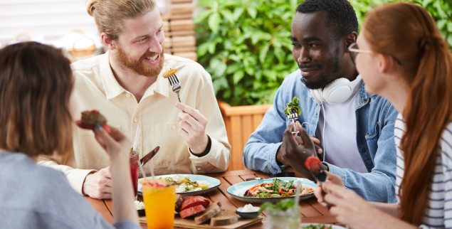 group of friends eating a healthy meal together